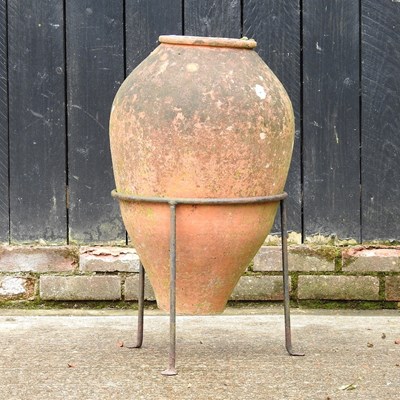 Lot 408 - A terracotta olive pot, on a metal stand, 71cm...