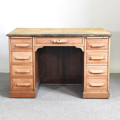 Lot 524 - A 1930's pedestal desk, containing nine short...