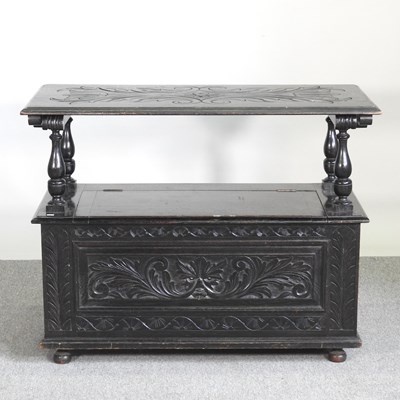 Lot 304 - An early 20th century carved oak monk's bench,...