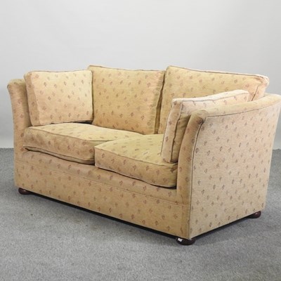 Lot 521 - A yellow upholstered two seater sofa