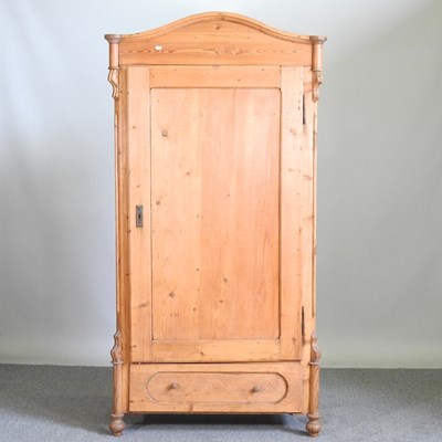 Lot 263 - An early 20th century continental pine armoire,...