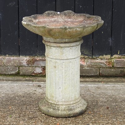 Lot 158 - A cast stone bird bath, 64cm high