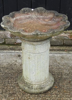 Lot 158 - A cast stone bird bath, 64cm high