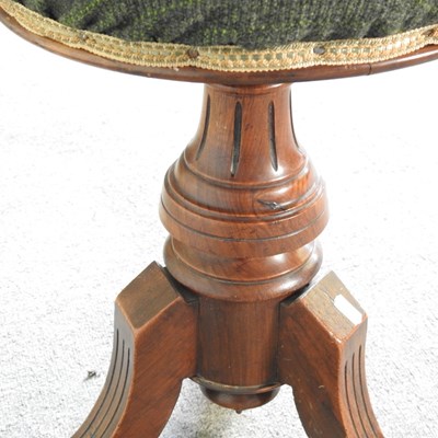 Lot 135 - A Victorian walnut revolving piano stool,...