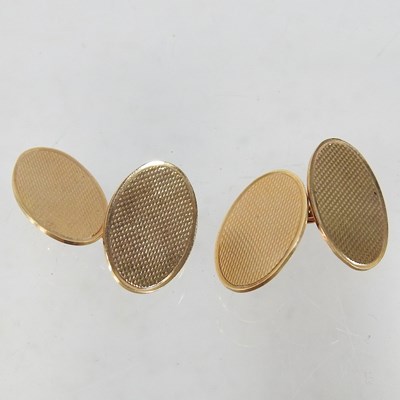 Lot 87 - A pair of 9 carat gold cufflinks, of oval...