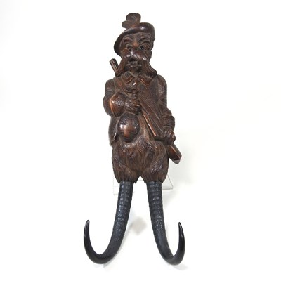 Lot 256 - A 19th century Black Forest carved wooden whip...