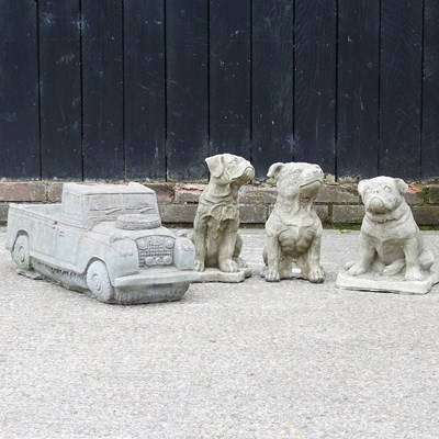 Lot 595 - A cast stone model of a land rover, together...