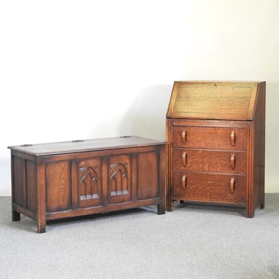 Lot 567 - A 1930's oak bureau, 69cm wide, together with...