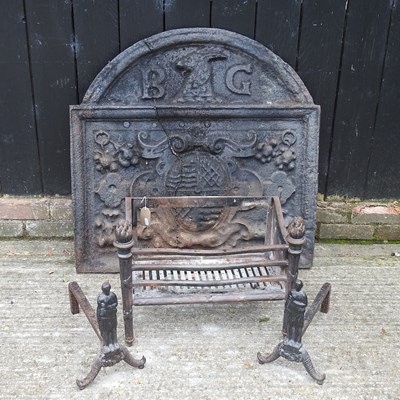 Lot 123 - A large cast iron fire back, of arched shape,...