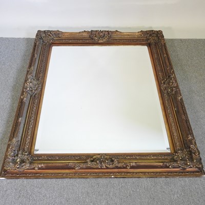 Lot 196 - A large modern gilt framed wall mirror, with a...