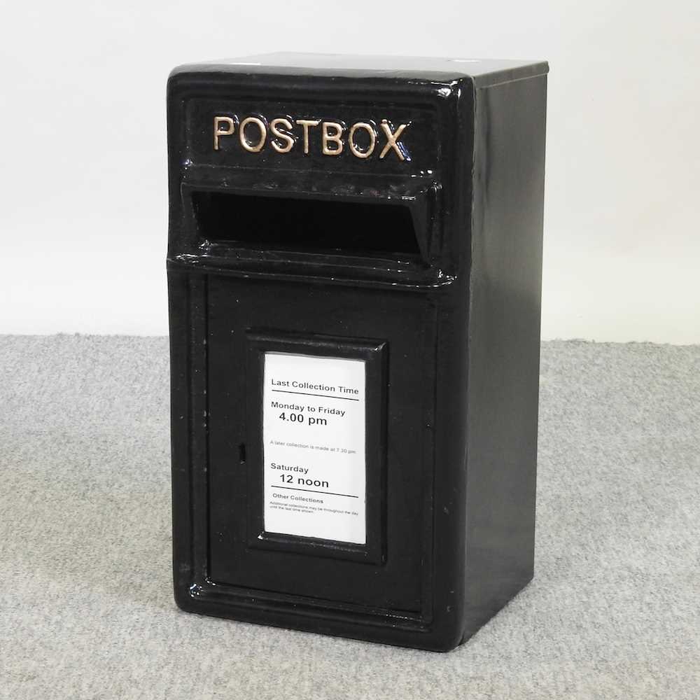 Lot 465 - A reproduction black painted cast iron post box