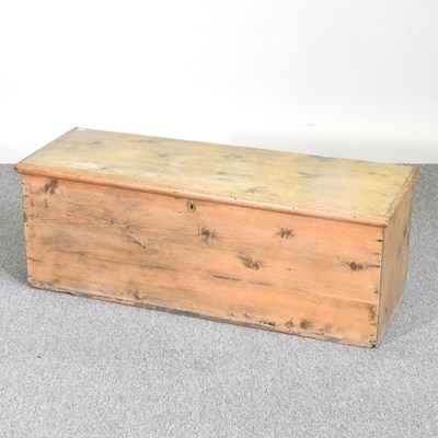 Lot 585 - An antique pine blanket box, with a hinged lid