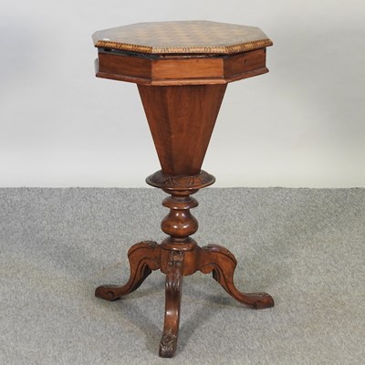 Lot 654 - A Victorian walnut and inlaid games/work table