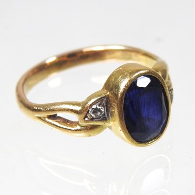 Lot 51 - A sapphire and diamond set three stone ring,...