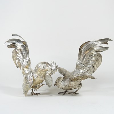 Lot 127 - A pair of silver models of fighting cockerels,...