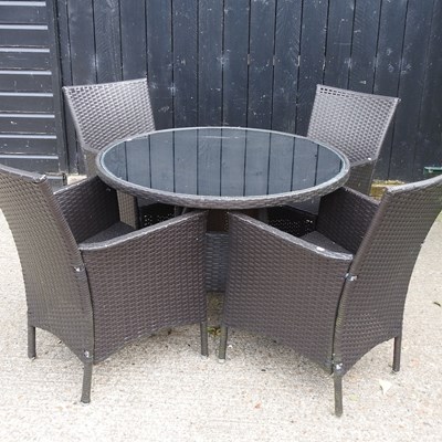 Lot 422 - A black rattan circular garden table, with a...