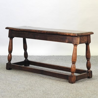 Lot 689 - An early 20th century burr elm bench