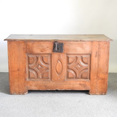 Lot 122 - An 18th century continental carved elm coffer,...