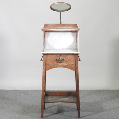 Lot 440 - An Edwardian oak marble top washstand