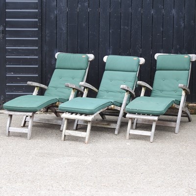 Lot 117 - A pair of teak folding garden steamer chairs,...