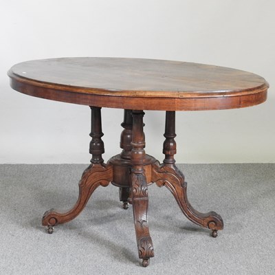 Lot 181 - A Victorian burr walnut oval dining table, on...