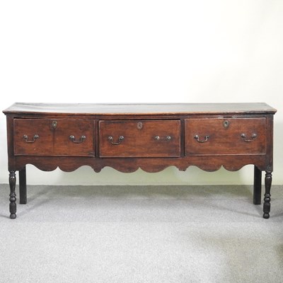 Lot 580 - An 18th century oak dresser base, later...