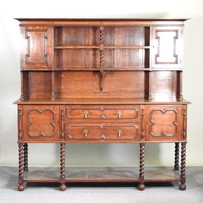 Lot 282 - A 1920's oak dresser, of Jacobean style, with...