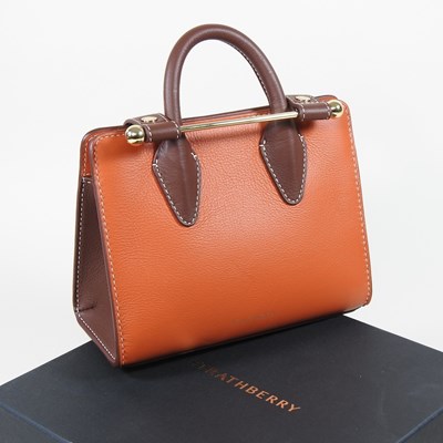 Lot 25 - A Strathberry nano tote bag in maple and...