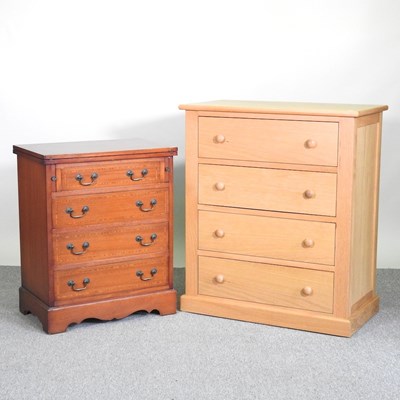 Lot 425 - A modern light oak chest of drawers, together...