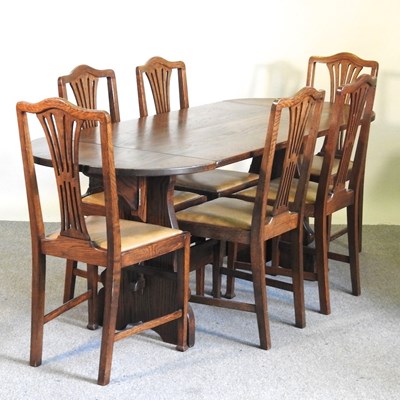 Lot 165 - An Ercol style drop-leaf dining table,...