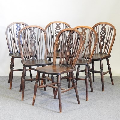 Lot 269 - A set of six wheel back dining chairs (6)