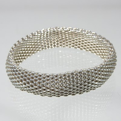 Lot 235 - A Tiffany & Co. silver mesh bracelet, stamped...