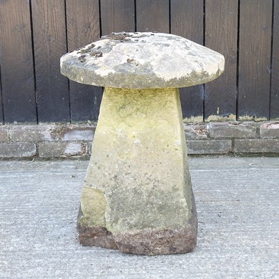 Lot 26 - A carved stone staddle stone, 64cm high