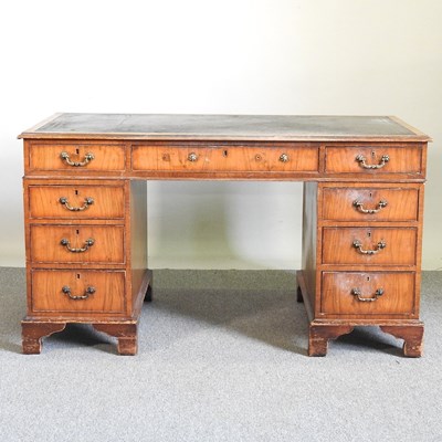 Lot 337 - A reproduction walnut twin pedestal desk, with...