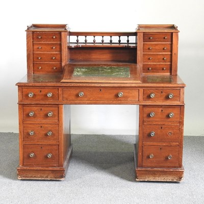 Lot 573 - A 19th century hardwood Dickens desk, with a...