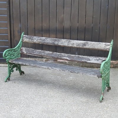 Lot 534 - A wooden garden bench, with green painted...