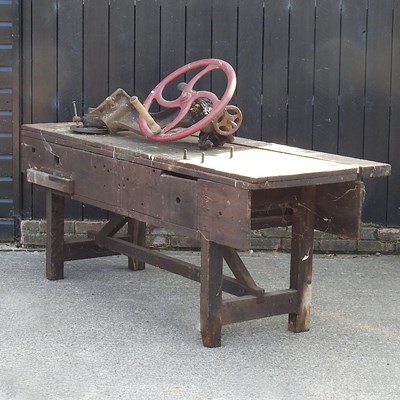 Lot 83 - A large wooden work bench, together with a...