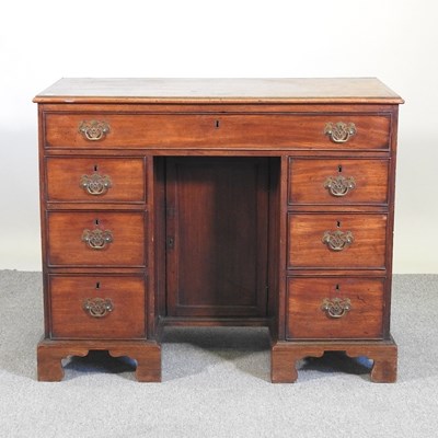 Lot 525 - A 19th century mahogany kneehole desk,...