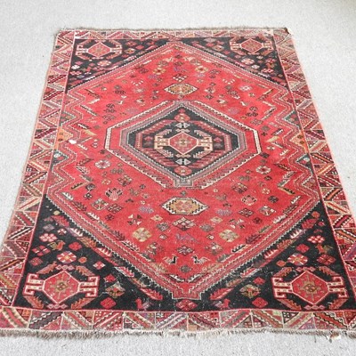 Lot 144 - A Turkoman rug, with a central hooked...