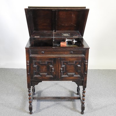 Lot 359 - A 1920's oak cased wind up gramophone, by...