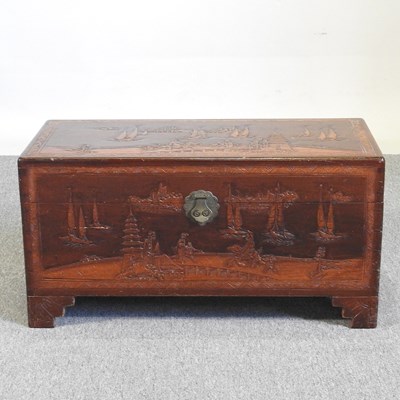 Lot 206 - A mid 20th century Eastern carved camphorwood...