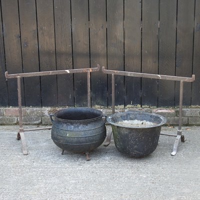 Lot 403 - An iron cauldron, together with another and a...