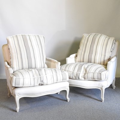 Lot 186 - A pair of cream French style armchairs, with...