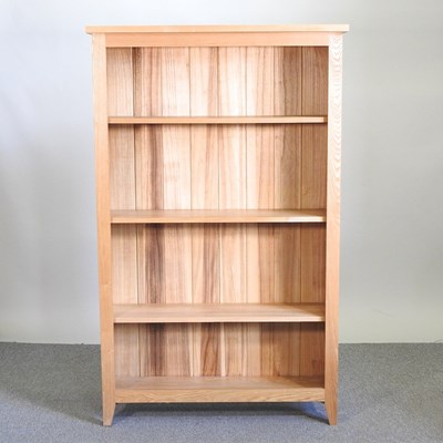 Lot 432 - A modern light oak open bookcase, with...