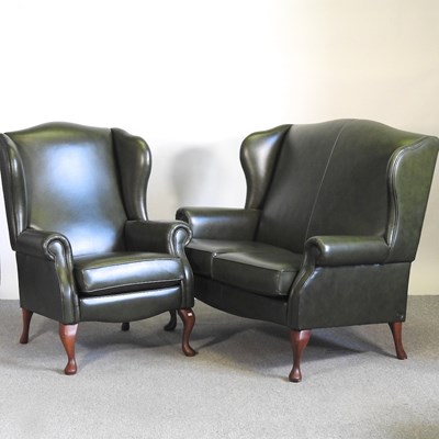 Lot 499 - A Sherborne green leather upholstered wing...