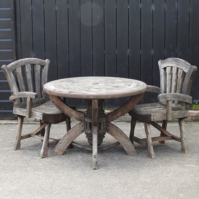 Lot 369 - A hardwood circular garden table