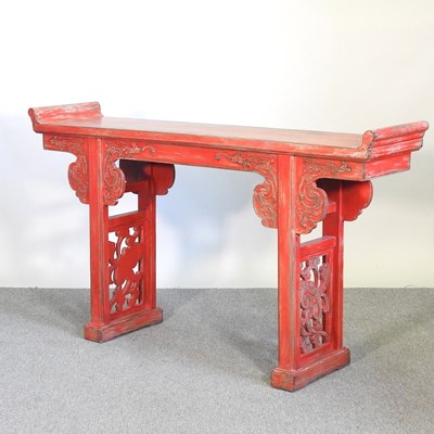 Lot 38 - A modern Chinese red painted lacquered table,...