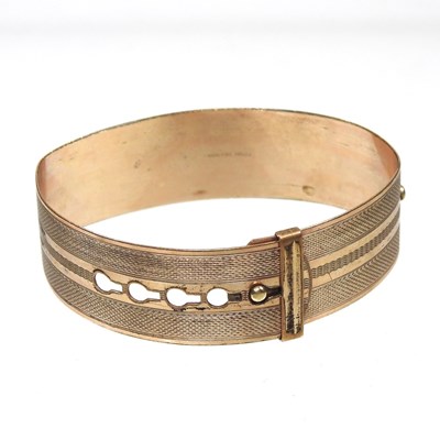 Lot 1 - A rolled gold bangle, of collar design, with...