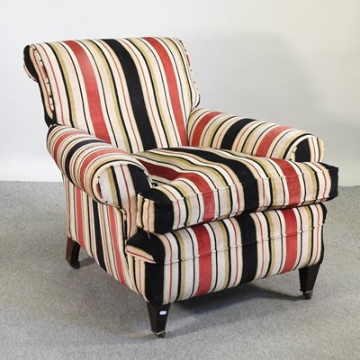 Lot 701 - A Howard style upholstered armchair