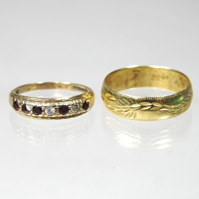 Lot 30 - An 18 carat gold wedding band, with engraved...